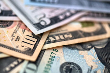 Big amount of different dollar bills close up. Hundred fifty twenty ten and five dollar banknotes