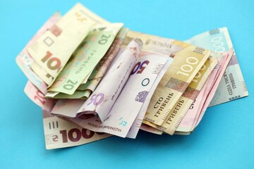 Big amount of different Ukrainian hryvnia money bills. Pile of crumpled ukrainian banknotes