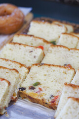 Delicious fruit cake slices on wooden board display