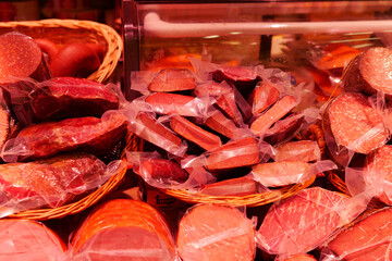 Variety of packaged meats displayed in a market stall