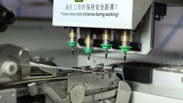 Close up shot of a robot machine making chips of led lights