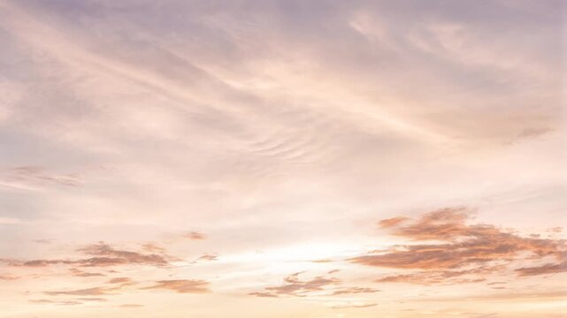 Realistic orange sky time lap with gray cloud background.