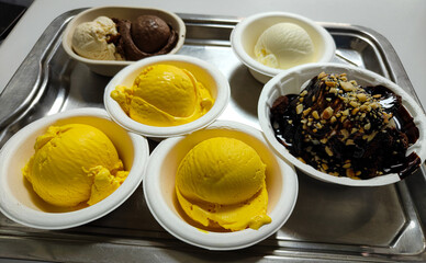 Various Ice Cream flavours in a plate, Mango, Chocolate, Vanilla, DBC