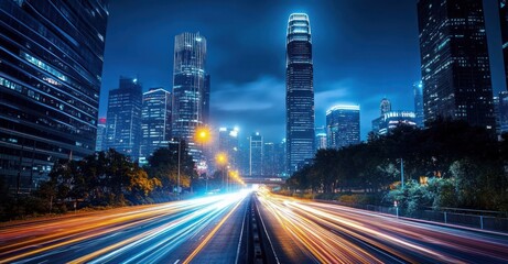 Nighttime cityscape featuring a busy multi-lane highway with bright light trails from fast-moving vehicles amidst tall illuminated skyscrapers under a deep blue sky