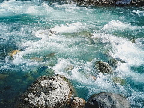 Close-up of a seething mountain river. Beautiful natural background.