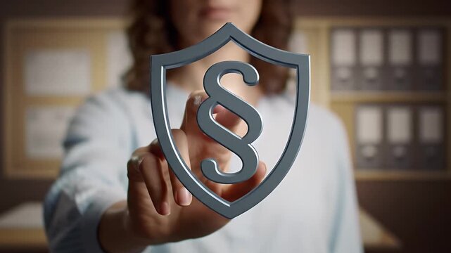 Close Up of Hand Touching a Paragraph Symbol Shield with Blurry Background for legal protection business solutions