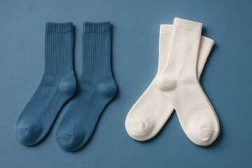 A pair of blue and white socks laid out on a textured blue background