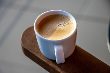 View on the cup of coffee during the morning, morning ritual - savoring freshly brewed coffee.