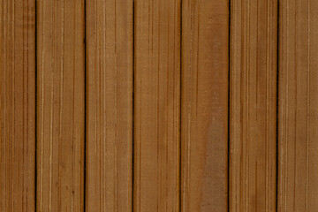 Fototapeta premium natural backdrop: close up of mat made of brown bamboo planks