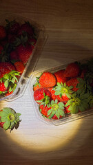 Vibrant strawberries bask in golden light, tempting tastebuds for a solstice picnic, invoking...