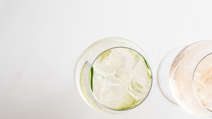 Effervescent gin and tonic with a citrus twist, capturing the zenith of midsummer revelry and...