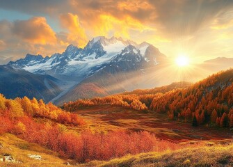 Sunrise over snow-capped mountains with golden sunlight illuminating vibrant autumn forest and colorful foliage in the foreground