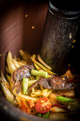 Basic ingredients of papaya salad in mortar