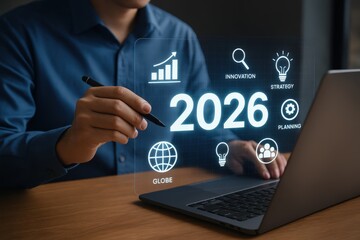 Person interacting with a futuristic interface displaying the year 2026 and related concepts.