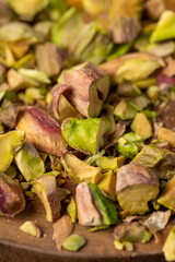 a bunch of green crunchy pistachios cooked with salt for beer, close up