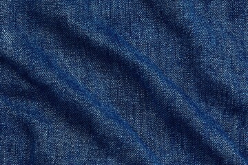 Naklejka premium Close-up view of textured blue denim fabric with visible weave and subtle folds