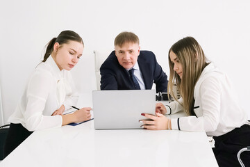 Fototapeta premium Business professionals collaborate on project in modern office setting during work hours