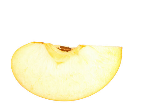 A single fresh slice of a yellow apple showing its pale flesh core and one brown seed.