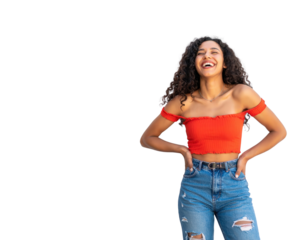Happy young woman with long curly hair laughing heartily in a red offtheshoulder top.