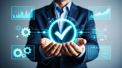 Businessman holding glowing check mark with digital data displays image