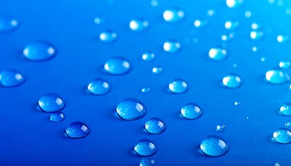 Close-up view of water droplets on a vibrant blue surface.