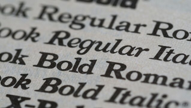 A close up shot of different font styles and weights on a white paper with a shallow depth of field - Powered by Adobe
