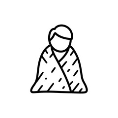 Person wrapping blanket around self symbolizing comfort and self care