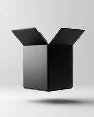 A sleek black box with open flaps, suspended in mid-air, creating a minimalist and modern aesthetic.
