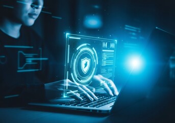 Person working on a laptop with a holographic security interface
