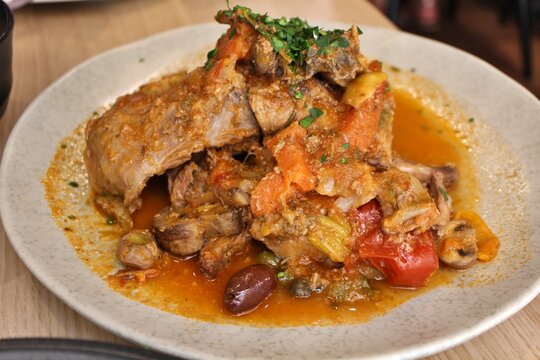 Maltese cuisine: stuffat tal-fenek (traditional Maltese stewed rabbit) in Valletta, Malta