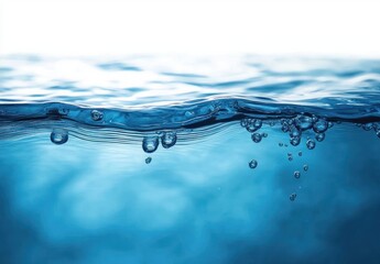 Close-up view of clear blue water surface with air bubbles rising underwater, serene and calm liquid environment