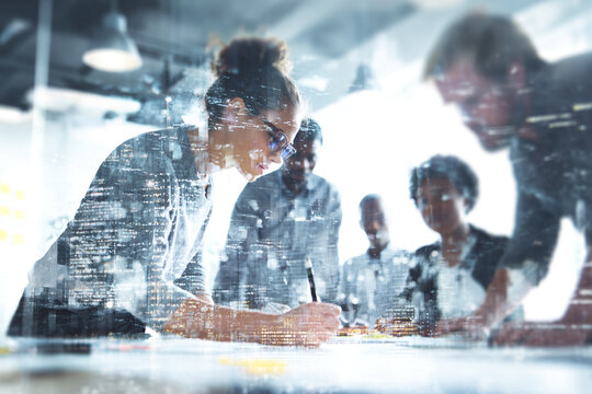 Diverse business team collaborating on project with city overlay meeting collaboration