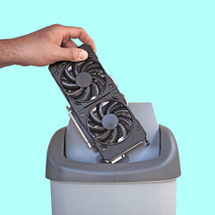 Old video cards are thrown into the trash. Disposal of faulty gadgets.