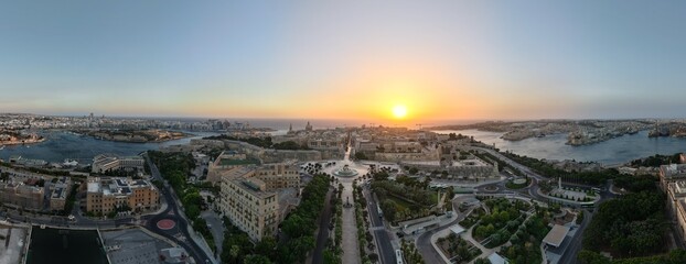 Fototapeta premium Valletta, Malta aerial drone panorama of historic old city at sunrise