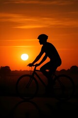 Obraz premium silhouette of a cyclist on the sunset