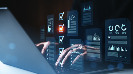 Data analysis and checklist verification concept with digital charts and graphs overlaid on hands typing on a laptop in a futuristic style on dark background.