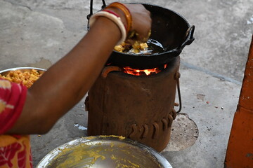Onion pakora frying in iron pen. This is a popular street food in Indian subcontinent. Onion which...