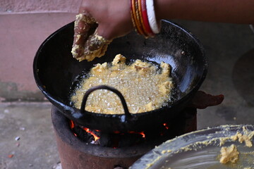 Onion pakora frying in iron pen. This is a popular street food in Indian subcontinent. Onion which...