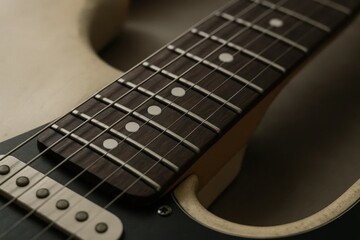 a close-up of a guitar's fretboard, highlighting the precision and artistry that goes into crafting melodies