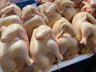 Fresh Raw Whole Chicken Carcasses Displayed For Sale On A Counter At A Local Farmers Market....