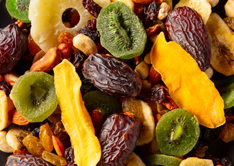 Dried tropical fruits with various nuts and raisins.