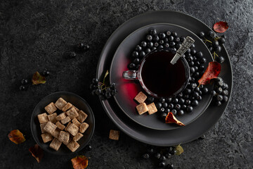 Black chokeberry juice, fresh berries, and pieces of brown sugar.