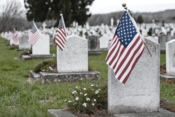 Rows of white military gravestones with American flags and small white flowers in a calm national cemetery