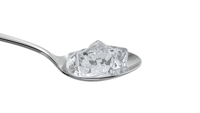 Closeup of shiny metal spoon with clear ice cubes isolated on the transparent background for refreshment and cooling concepts
