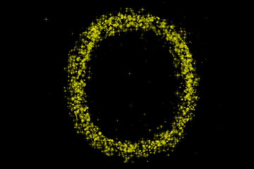 Abstract glowing yellow and green particles forming an oval shape against a dark black background