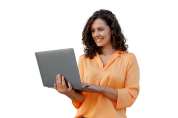 Curly-haired woman wearing orange shirt, working on laptop with friendly smile against transparent backdrop