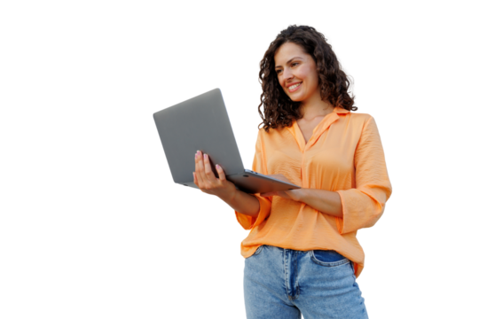 Smiling professional with curly hair working on laptop, wearing casual attire, embodying contemporary workplace energy and personal achievement
