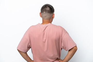 Fototapeta premium Young caucasian man isolated on white background in back position