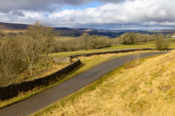 Remote Single track in Teesdale on a sunny spring day, County Durham, England, UK.