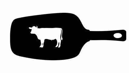 Silhouette of a white cow inside a black spatula with a handle and a hole for hanging it up in kitchen